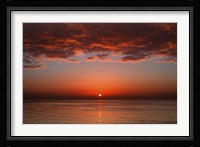 A layer of clouds is lit by the rising sun over Rio de la Plata, Buenos Aires, Argentina Fine Art Print