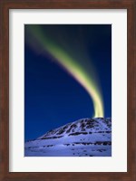 An aurora borealis shooting up from Toviktinden Mountain, Norway Fine Art Print