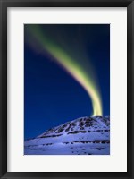 An aurora borealis shooting up from Toviktinden Mountain, Norway Fine Art Print