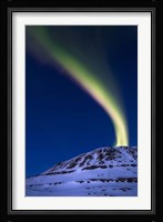 An aurora borealis shooting up from Toviktinden Mountain, Norway Fine Art Print