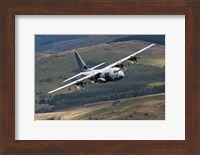 A C-130 Hercules of the Royal Air Force flying over North Wales Fine Art Print
