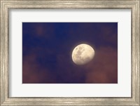 The moon between colorful clouds at sunset Fine Art Print
