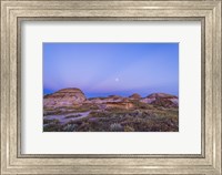 Gibbous moon and crepuscular rays over Dinosaur Provincial Park, Canada Fine Art Print