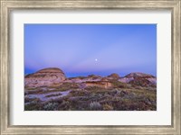 Gibbous moon and crepuscular rays over Dinosaur Provincial Park, Canada Fine Art Print