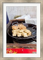 China, Shanghai. Village of Zhujiajiao. Homemade snacks cooked in wok. Fine Art Print