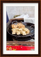 China, Shanghai. Village of Zhujiajiao. Homemade snacks cooked in wok. Fine Art Print