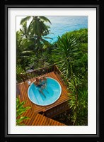 Couple enjoying hot tub at Fregate Resort, Seychelles Fine Art Print