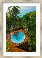 Couple enjoying hot tub at Fregate Resort, Seychelles Fine Art Print