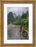 Bicycle sits in front of the Guilin Mountains, Guilin, Yangshuo, China Fine Art Print