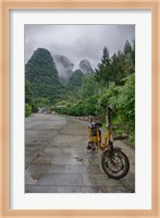 Bicycle sits in front of the Guilin Mountains, Guilin, Yangshuo, China Fine Art Print