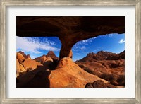 Boy under natural rock arch at Spitzkoppe, Namibia Fine Art Print