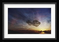 A despairing man sits on the beach, watching as the sun sets on his heart Fine Art Print