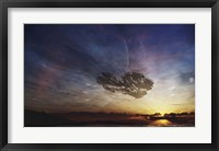 A despairing man sits on the beach, watching as the sun sets on his heart Fine Art Print