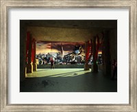 A woman spys from the shadows as a utility craft swoops into view Fine Art Print