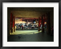 A woman spys from the shadows as a utility craft swoops into view Fine Art Print