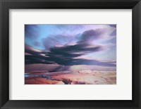 A swift moving thunderstorm moves over a desert landscape Fine Art Print