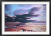 A swift moving thunderstorm moves over a desert landscape Fine Art Print