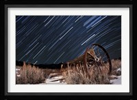 Abandoned farm equipment against a backdrop of star trails Fine Art Print