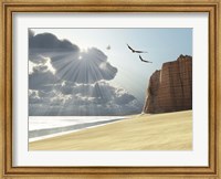 Sunlight shines down on two birds flying near a cliff by the ocean Fine Art Print