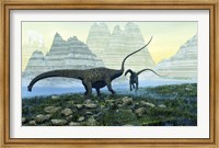 Diplodocus dinosaurs munch on vegetation near a mountain lake Fine Art Print