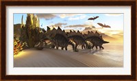 Stegosaurus dinosaurs graze among the vegetation by a lake in the Jurassic Period Fine Art Print