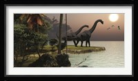 Two Brachiosaurus dinosaurs enjoy a beautiful sunset Framed Print
