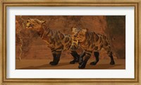 Two Smilodon cats find protection in a vast cave system Fine Art Print