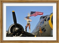 1940's style majorette pin-up girl on a B-17 bomber with an American flag Fine Art Print