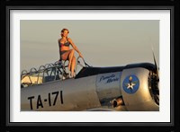1940's style pin-up girl sitting on the cockpit of a World War II T-6 Texan Fine Art Print