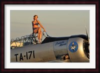 1940's style pin-up girl sitting on the cockpit of a World War II T-6 Texan Fine Art Print