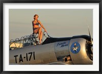 1940's style pin-up girl sitting on the cockpit of a World War II T-6 Texan Fine Art Print
