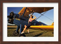 1940's style pin-up girl sitting on the wing of a Stearman biplane Fine Art Print