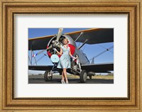 Elegant 1940's style pin-up girl standing in front of an F3F biplane Fine Art Print