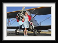 Elegant 1940's style pin-up girl standing in front of an F3F biplane Fine Art Print