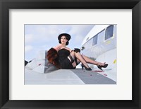 Glamorous woman in 1940's style attire sitting on a vintage aircraft Fine Art Print