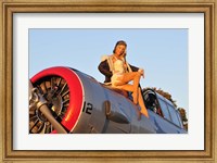 1940's style aviator pin-up girl posing with a vintage T-6 Texan aircraft Fine Art Print