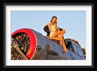 1940's style aviator pin-up girl posing with a vintage T-6 Texan aircraft Fine Art Print