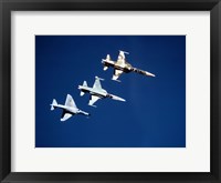 Two F-5 Tiger II's and an A-4E Skyhawk in flight above the Pacific Ocean Fine Art Print