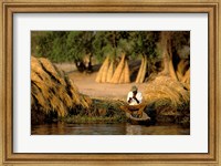 Local Man Fishing and Piles of Straw for Hatch, Okavango Delta, Botswana Fine Art Print