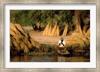 Local Man Fishing and Piles of Straw for Hatch, Okavango Delta, Botswana Fine Art Print