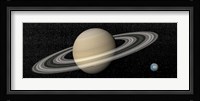 Large planet Saturn and its rings next to small planet Earth Fine Art Print