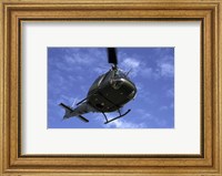 Former US Air Force Bell UH-1E Huey helicopter in flight Fine Art Print