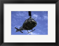 Former US Air Force Bell UH-1E Huey helicopter in flight Fine Art Print