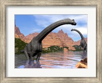 Two Brachiosaurus dinosaurs in water next to red rock mountains Fine Art Print