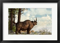 A woolly rhinoceros trudges through the snow, Pleistocene epoch Fine Art Print