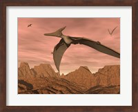 Three pteranodon dinosaurs flying above rocky landscape Fine Art Print