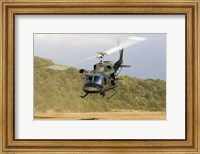 An Italian Air Force AB-212 ICO helicopter departs the landing zone, Italy Fine Art Print