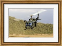 An Italian Air Force AB-212 ICO helicopter departs the landing zone, Italy Fine Art Print