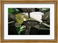Two instructor pilots practice low flying operations in a UH-1H Huey helicopter Fine Art Print