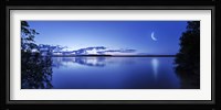Moon rising over tranquil lake against moody sky, Mozhaisk, Russia Fine Art Print